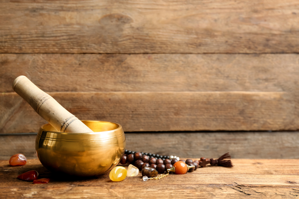 Composition with Golden Singing Bowl on Wooden Table, Space for Text. Sound Healing